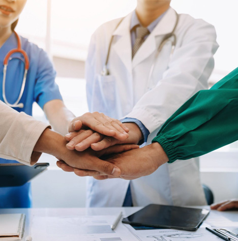 Team putting all hands in